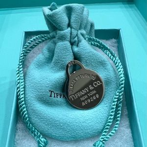 Authentic Tiffany & Co. Return to Tiffany Round Charm. Comes with bag and box!